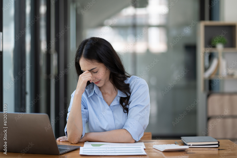 business woman frustrated and stressed holding by head. business woman frustrated and stressed holding by head.