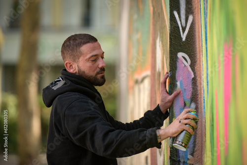 view of an artist doing street art in Paris