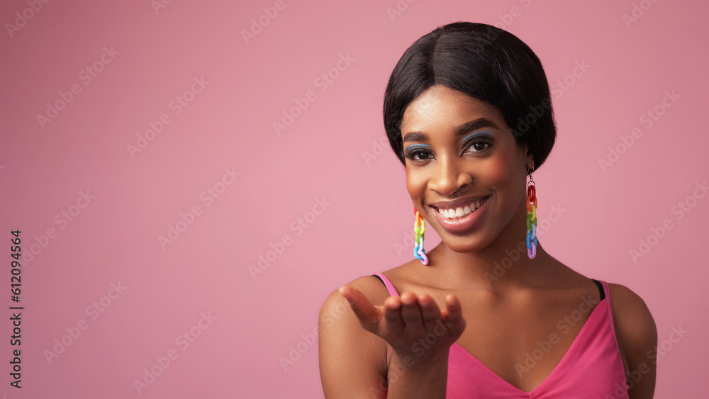 Welcome gesture. Cheerful face. Advertising portrait. Happy woman with beautiful toothy smile hand open palm isolated on pink color empty space background. Welcome gesture. Cheerful face. Advertising portrait. Happy woman with beautiful toothy smile hand open palm isolated on pink color empty space background.