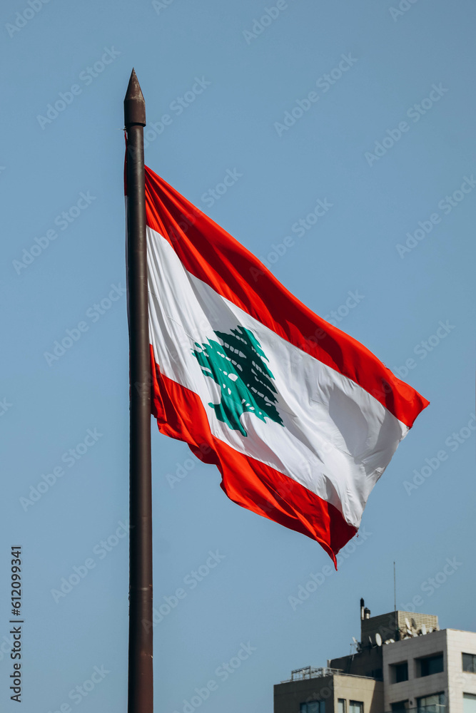 Obraz premium The Lebanese flag in the center of Beirut fluttering in the wind