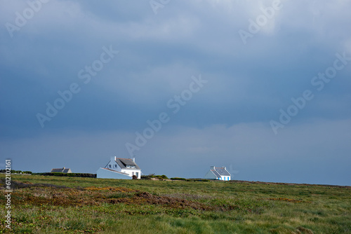 Small white breton houses at the coast of Brittany
