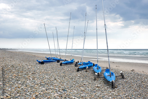 Group of sand yachts on pebble beach