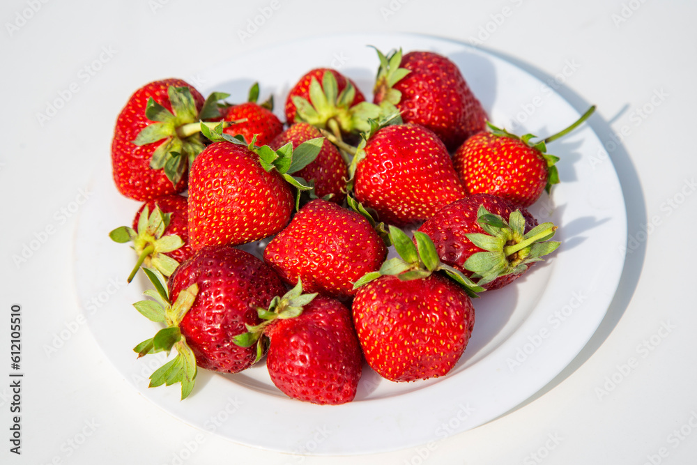 strawberries in a bowl on white background strawberries in a bowl on white background