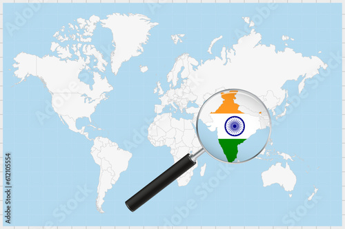Magnifying glass showing a map of India on a world map.