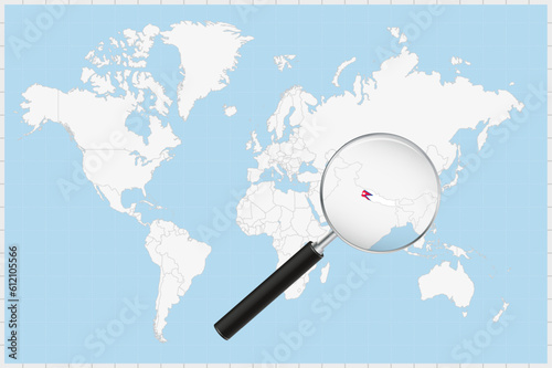Magnifying glass showing a map of Nepal on a world map.
