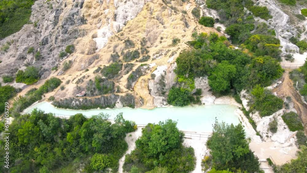 Bagno Vignoni natural pools along the city hill in Tuscany, view in spring season from drone Bagno Vignoni natural pools along the city hill in Tuscany, view in spring season from drone