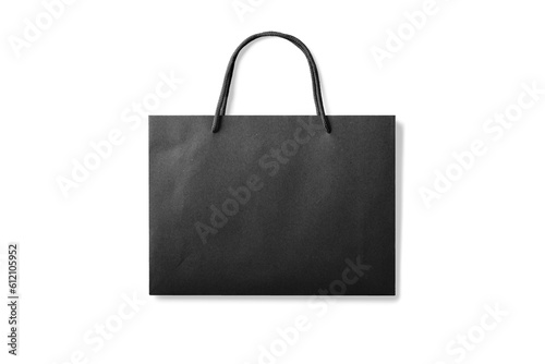 Black kraft paper shopping bag with handles isolated on a transparent background, PNG. High resolution. 