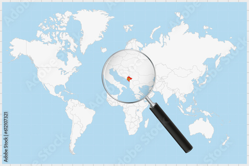 Magnifying glass showing a map of Montenegro on a world map.