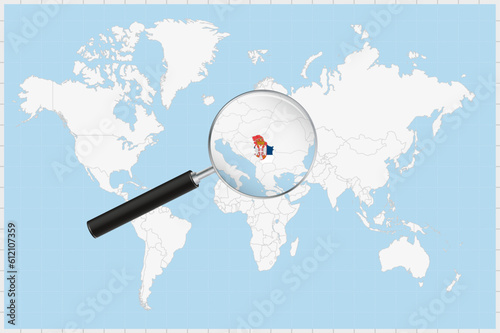 Magnifying glass showing a map of Serbia on a world map.