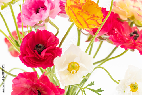 Elegant mixed ranunculus spring bouquet close up on white background. Spring buttercups. Ranunculus bouquet.