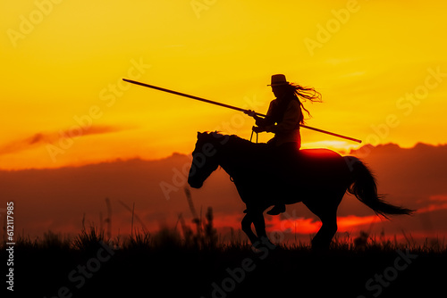silhouette of a woman on horseback with a long spear