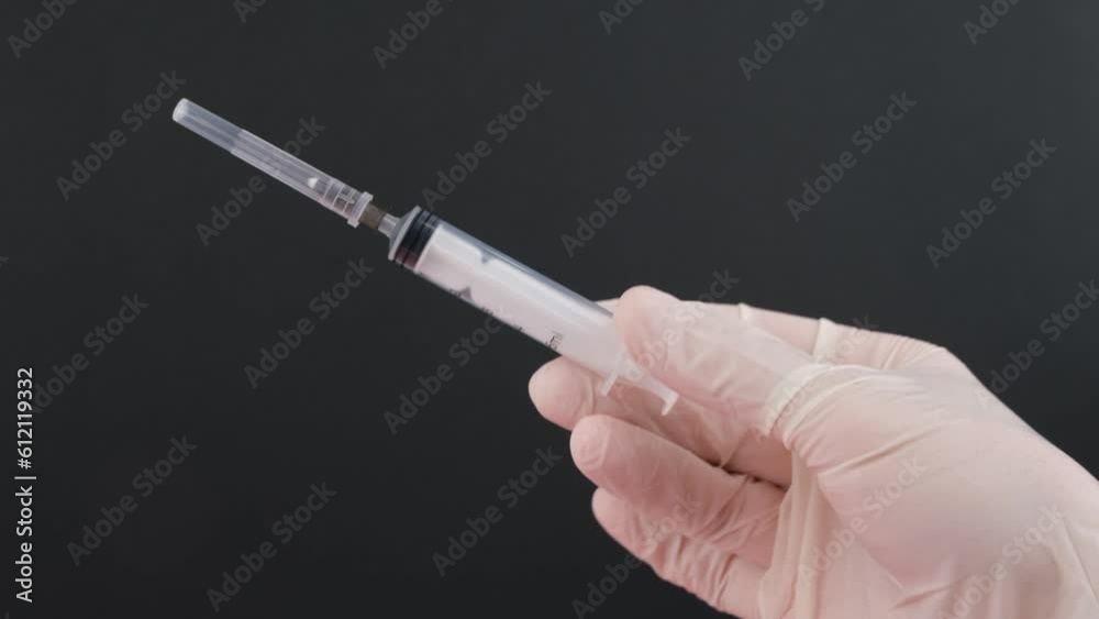 hand holding syringe