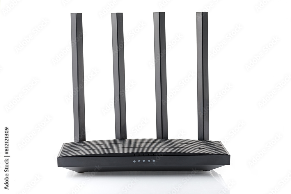 Wireless wi-fi black router with four antennas isolated on white. High speed internet connection, firewall network and telecommunication technology concept. 2,4 and 5 ghz Wireless wi-fi black router with four antennas isolated on white. High speed internet connection, firewall network and telecommunication technology concept. 2,4 and 5 ghz