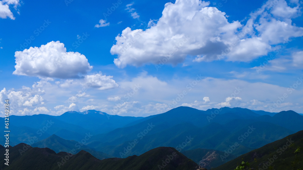 Incredible mountains and blue sky with clouds - generative ai