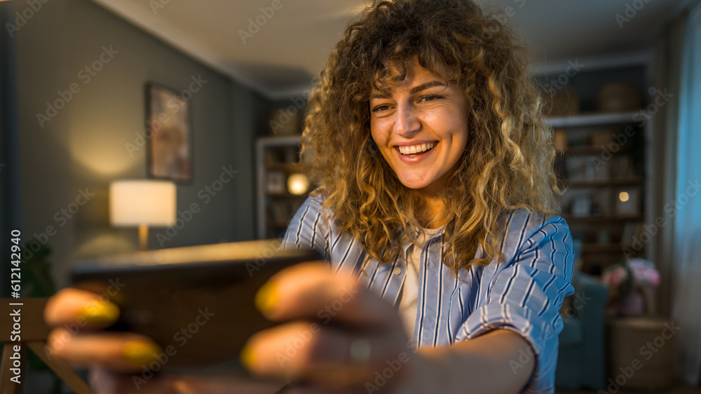 woman caucasian play video games on smartphone mobile phone at home woman caucasian play video games on smartphone mobile phone at home