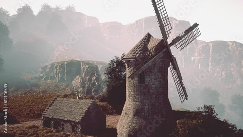 Landscape view on the old windmill photo