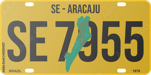 Old license plate Aracaju - SE - Brazil 1970 yellow. State map in the background in green color. Fountain Bebas Neue