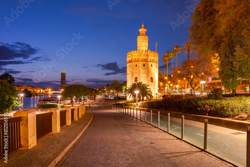 Famous watchtower Golden Tower or Torre del Oro and River Guadalquivir at sunset, Seville, Andalusia, Spain
