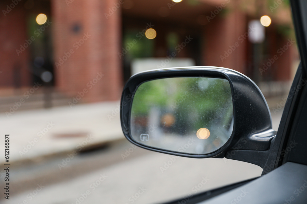 A car mirror reflects the journey ahead, symbolizing self-reflection, perspective, awareness, and the constant pursuit of progress A car mirror reflects the journey ahead, symbolizing self-reflection, perspective, awareness, and the constant pursuit of progress