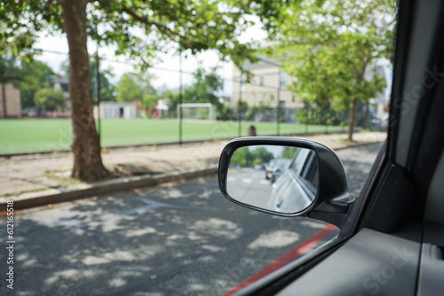 A car mirror reflects the journey ahead  symbolizing self-reflection  perspective  awareness  and the constant pursuit of progress