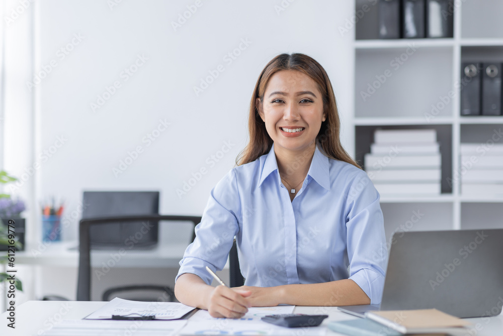 Asian Business woman using calculator and laptop for doing math finance on an office desk, tax, report, accounting, statistics, and analytical research concept
Asian Business woman using calculator and laptop for doing math finance on an office desk, tax, report, accounting, statistics, and analytical research concept