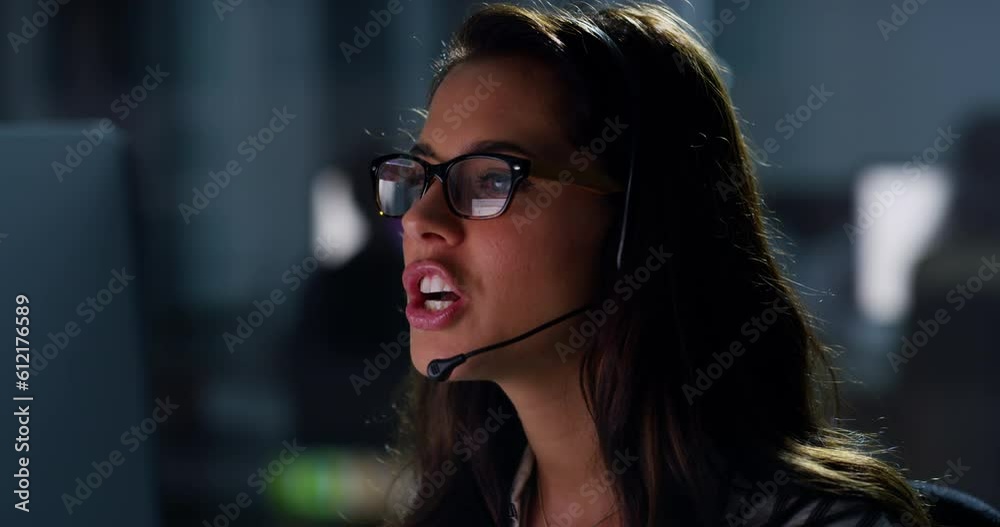 Customer service, night and telemarketing agent in the office doing computer consultation with headset. Dark, technology and woman call center consultant working overtime on crm online in workplace