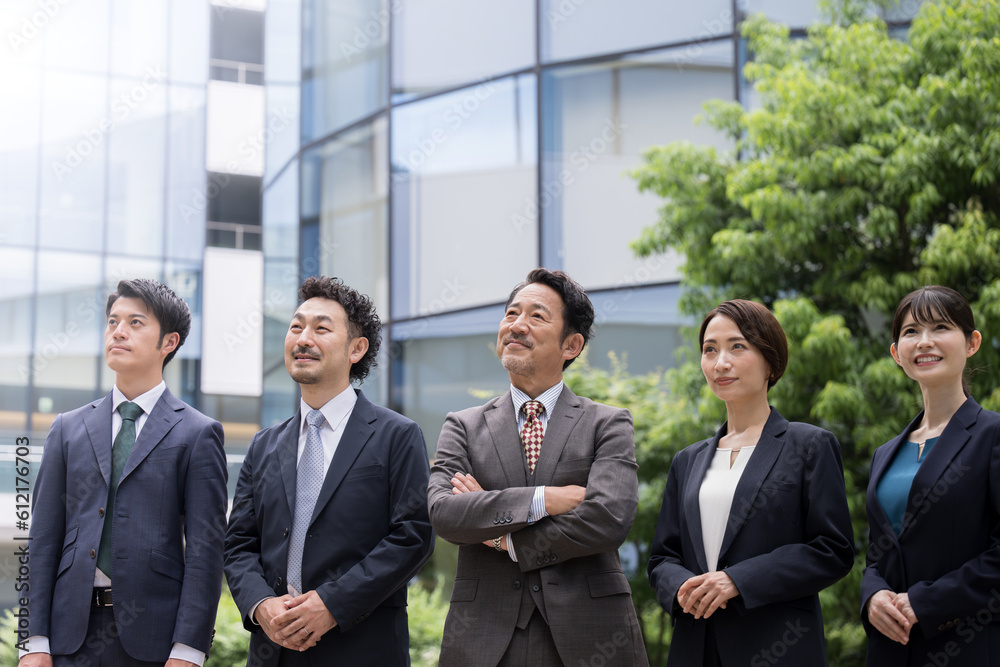 Image of multiple company employees looking up, easy to use for business purposes Copy space available above Image of multiple company employees looking up, easy to use for business purposes Copy space available above