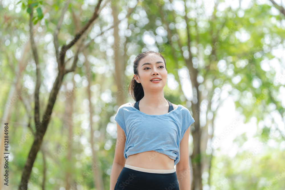 Fitness Asian woman doing yoga in park and jogging at city park in summer morning. Healthy female athlete enjoy outdoor sport training workout exercise and running, Healthy and happy women concept. Fitness Asian woman doing yoga in park and jogging at city park in summer morning. Healthy female athlete enjoy outdoor sport training workout exercise and running, Healthy and happy women concept.