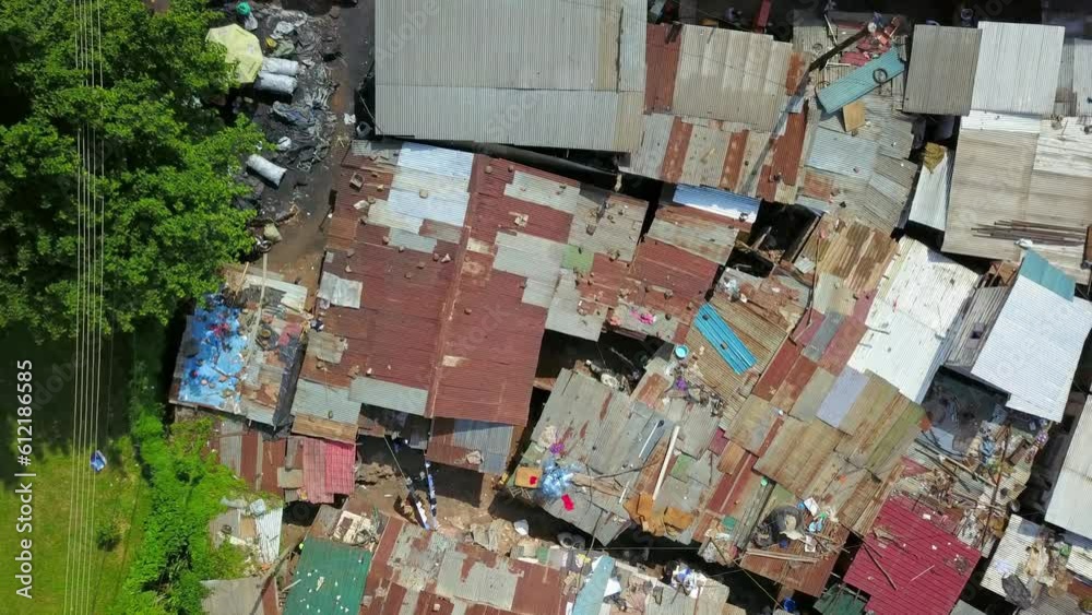 Top View Of Rusty Slum Roofs Near Bugolobi In Kampala, Uganda. Aerial Shot Top View Of Rusty Slum Roofs Near Bugolobi In Kampala, Uganda. Aerial Shot