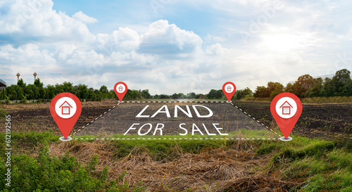 Land plot management - real estate concept with a vacant land on a green field available for building construction and housing subdivision.