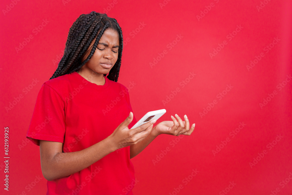Worried african woman using a mobile phone Worried african woman using a mobile phone
