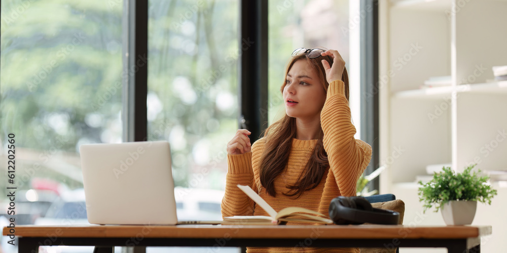 Beautiful young Asian woman college student at classroom. College student working on the college campus. back to school concept Beautiful young Asian woman college student at classroom. College student working on the college campus. back to school concept