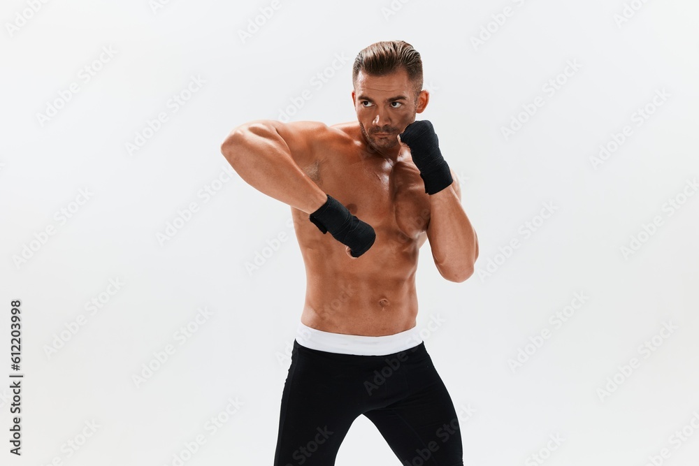 Man athletic bodybuilder poses in boxing gloves with nude torso abs in full-length background, boxing and martial arts. Advertising, sports, active lifestyle, competition, challenge concept. Man athletic bodybuilder poses in boxing gloves with nude torso abs in full-length background, boxing and martial arts. Advertising, sports, active lifestyle, competition, challenge concept.