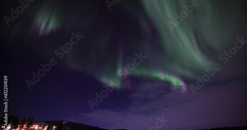 Real-Time Dancing Northern Lights over a frozen lake in Lapland, Finland