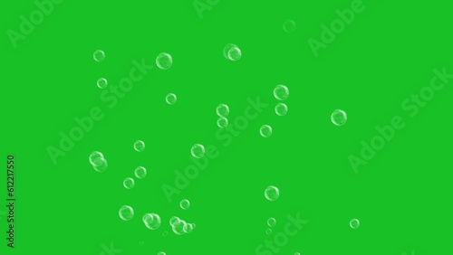 Flying soap bubbles on green screen background motion graphic effects. 