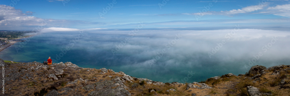 View from the summit of Bray Head with sea mist rolling over the coastline
