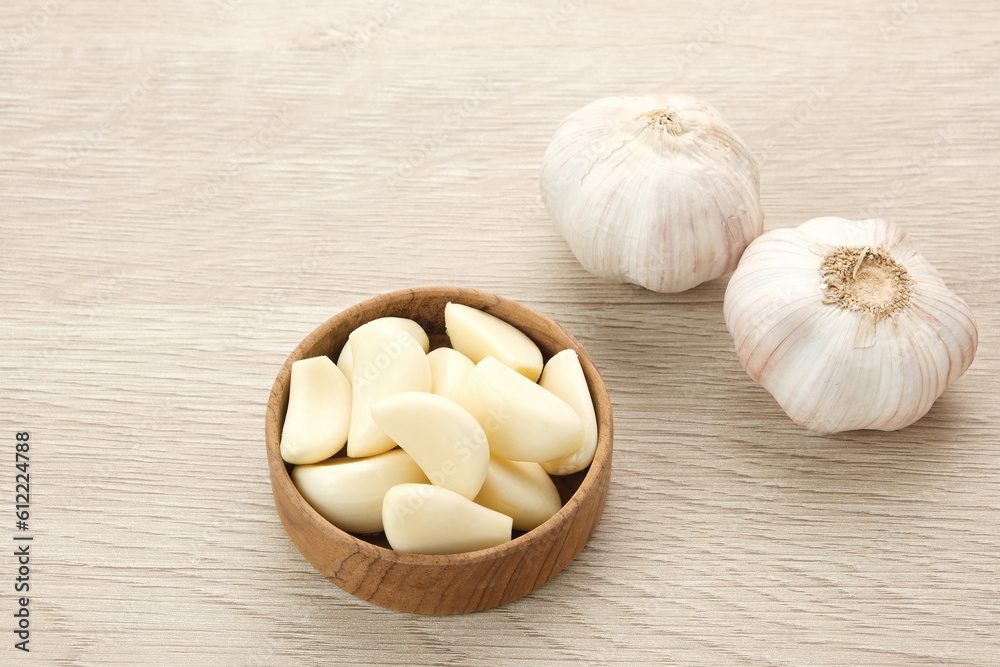 Fresh garlic (bawang putih) on a wooden table
