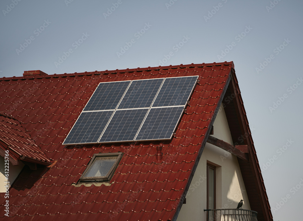 Eco-Friendly Energy Solution with Solar Panels on a Modern Residential House. Solar panels on the roof of the contemporary house. Sustainable future concept.