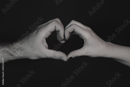 Female and male hands in form of heart. Hands in shape of love heart. Heart from hands. Man and woman hand in heart form love. Sign hearts by fingers. Love on Valentine day. Love sign.