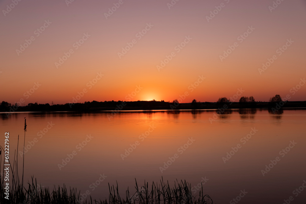 a beautiful reflection of the colorful sky in the water at sunset a beautiful reflection of the colorful sky in the water at sunset