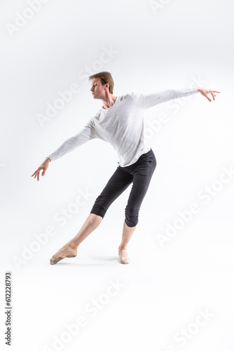 Full Length portrait of Caucasian Young, Handsome, Sporty Athletic Ballet Dancer with Lifted Hands on White.