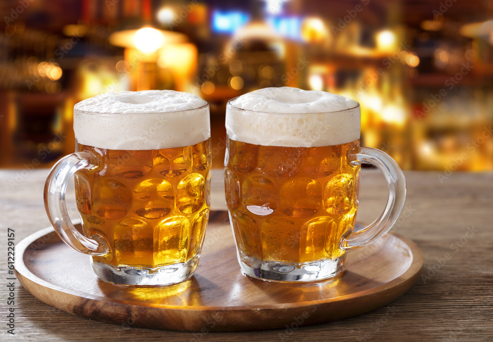 Mugs of beer in a bar Mugs of beer in a bar