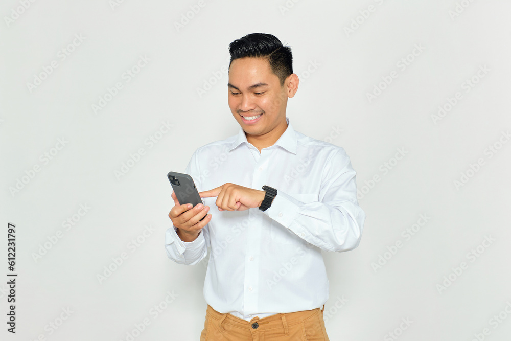 Portrait of happy young Asian man in formal wear using mobile phone for texting message or checking social media isolated on white background Portrait of happy young Asian man in formal wear using mobile phone for texting message or checking social media isolated on white background