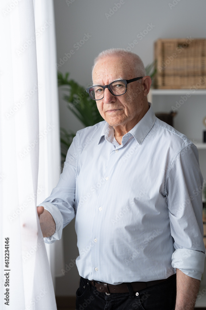 Portrait of confident elderly man standing