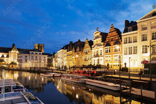 Belgium, East Flanders, Ghent, Historic houses along Korenleiand Lys river at night photo