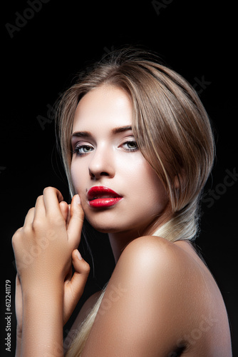 Woman model holding hands near face. Red lips makeup  clean skin beauty style with wet blonde hair