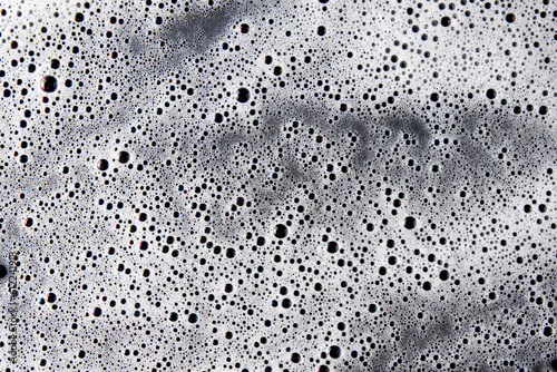 Abstract background white soapy foam texture. Shampoo foam with bubbles