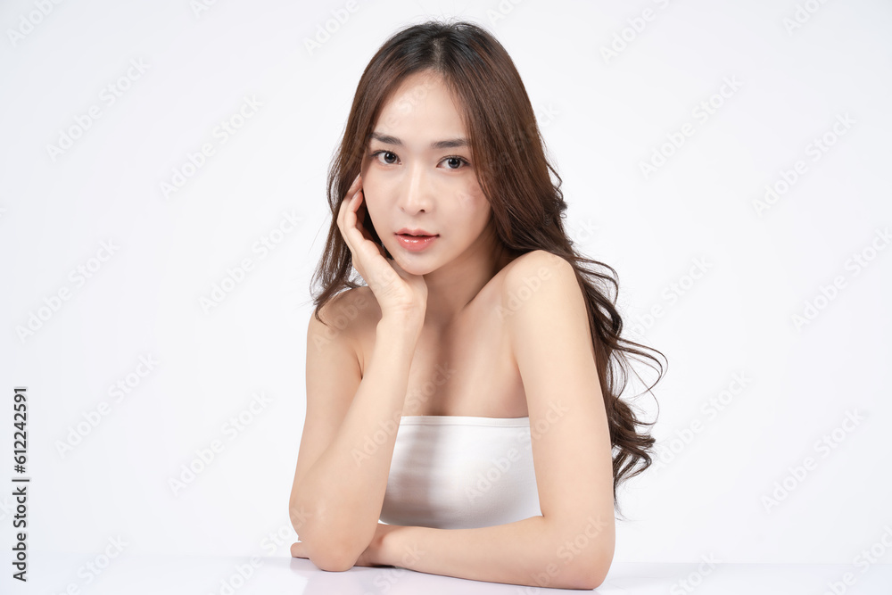 Asian woman with natural makeup smiling and touching her face. Skincare and Cosmetology concept with white background. Asian woman with natural makeup smiling and touching her face. Skincare and Cosmetology concept with white background.