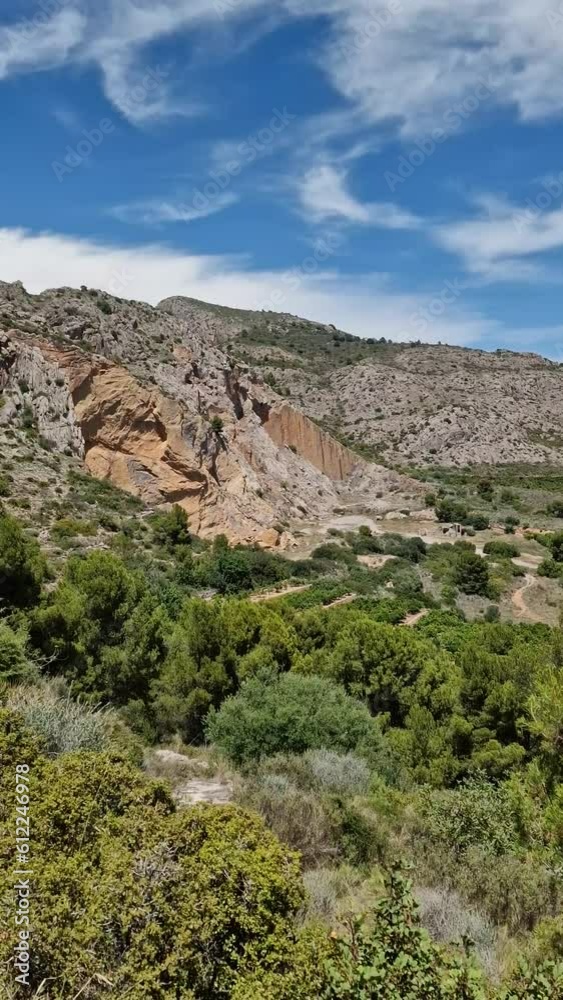 View of mountains and fields in the province of Castellon in Spain. Highway with cars and trucks. View of mountains and fields in the province of Castellon in Spain. Highway with cars and trucks.