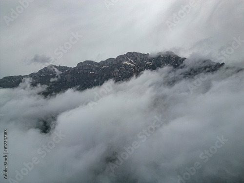 Mystic Tapestry: Exploring the Ethereal Landscapes and Fog-Laden Mountain Peaks © emerald_media